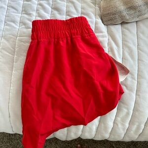 red athletic shorts- never worn